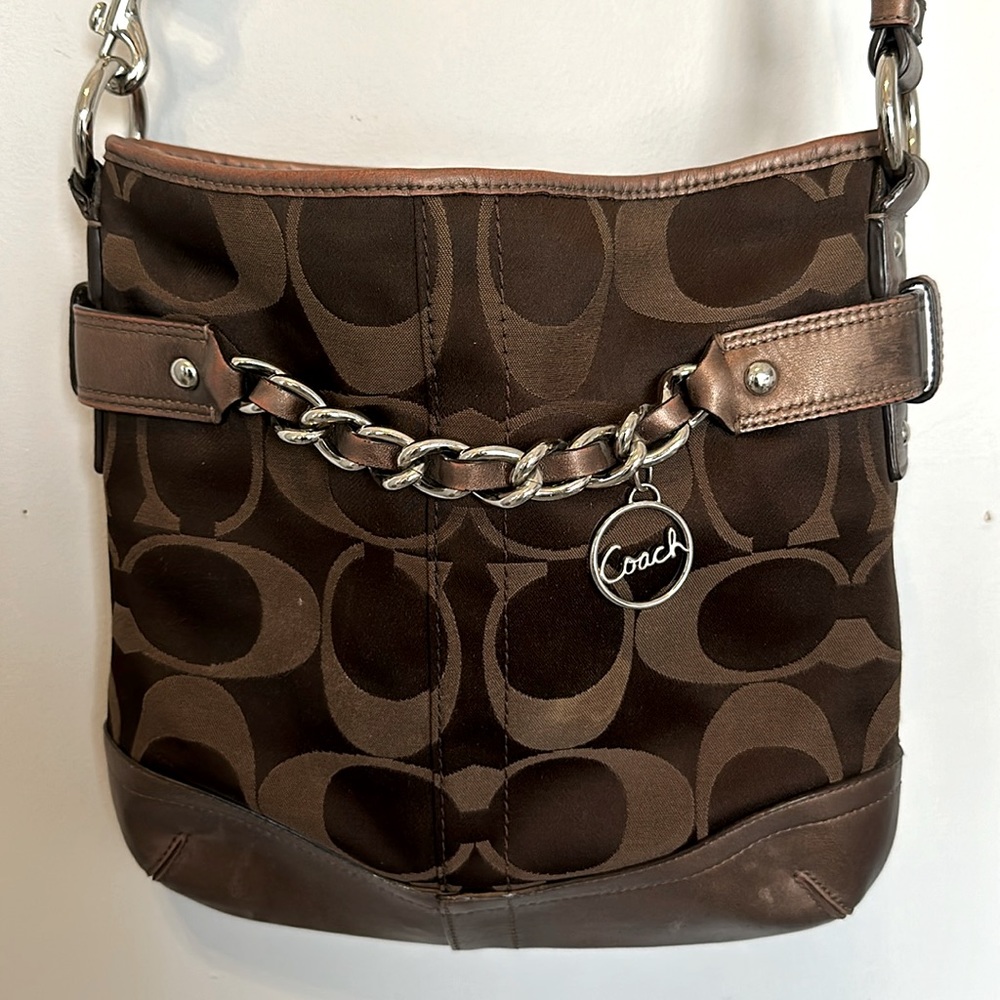 Coach signature crossbody bag in brown.